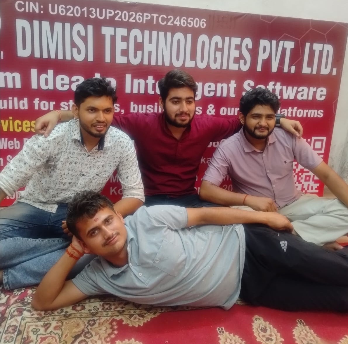 The DIMISI Technologies company board on the office gate and home workstation setup
